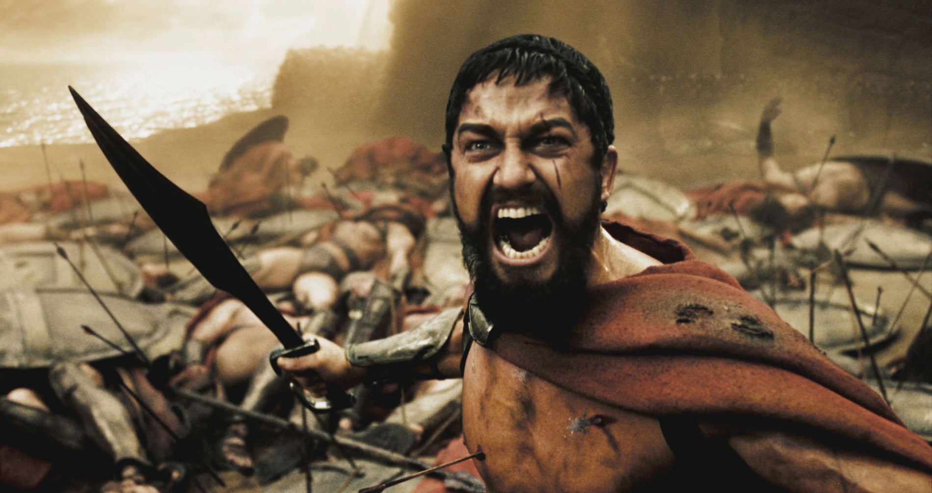 Photo of a spartan soldier raging with a pile of fallen soldiers behind.